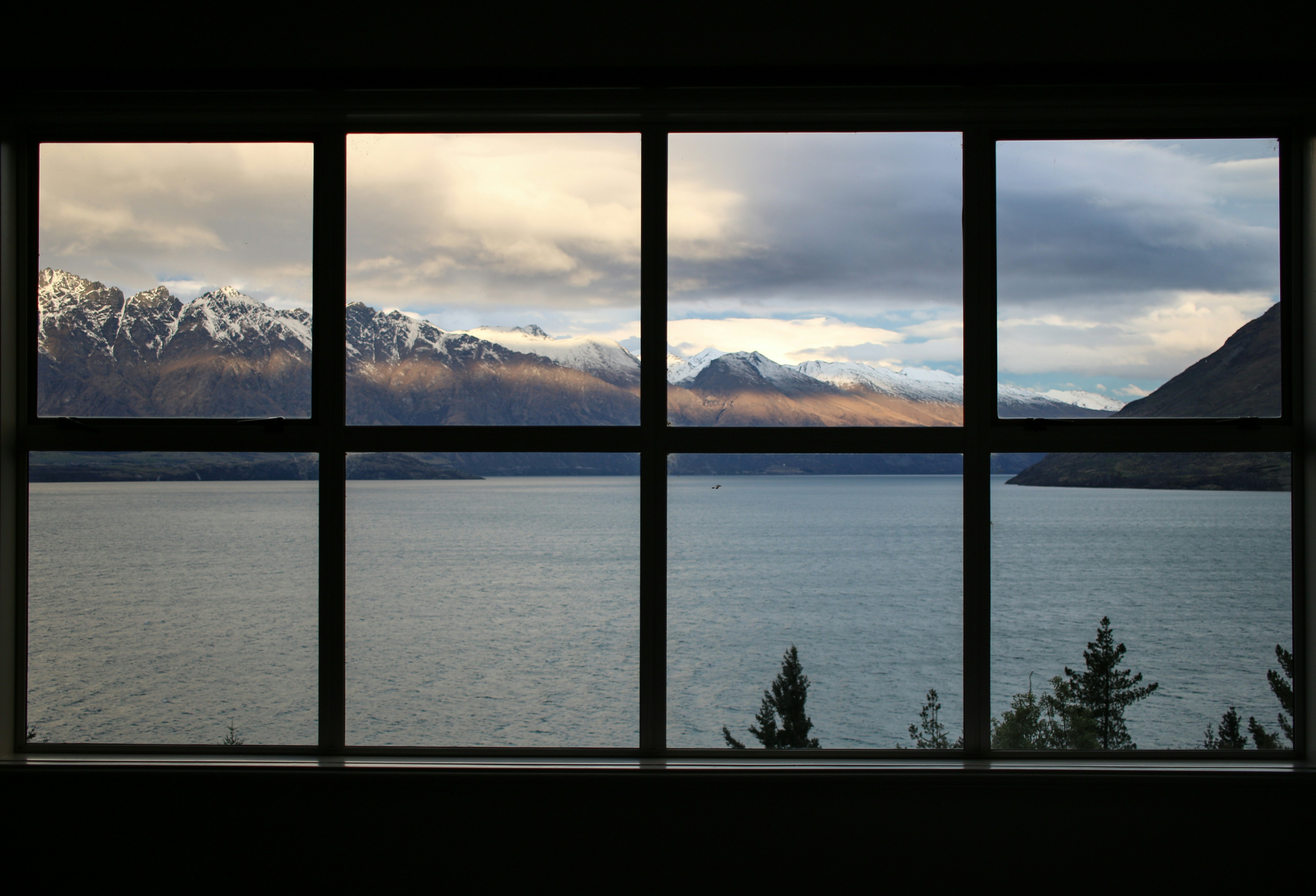 Reference image of windows framing a mountain and lake view